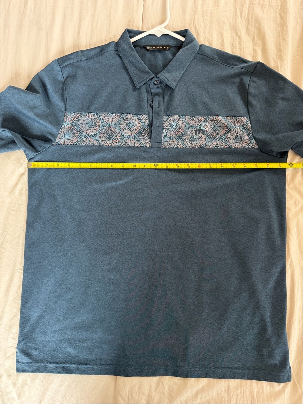 Travis Mathew Teal Blue Polo with Patterned Chest Stripe